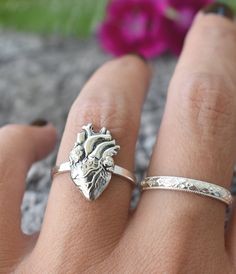 "Anatomical Heart Ring details: -Solid .925 sterling silver -Phases section measures 17mm x 10mm -Smooth ring band measures 2mm wide -Comfortable and easily stackable! -US Sizes 6-8 *Anatomical Heart Stacking Ring set shown here: https://www.etsy.com/listing/843409056/anatomical-heart-ring-sterling-silver?ref=shop_home_active_1&frs=1 Looking for a last minute or unique Christmas gift? Visit our \"READY TO SHIP\" section here, ships out in one business day https://www.etsy.com/shop/AWildViole Engraved Heart Ring For Promise, Engraved Heart Promise Ring, Nickel-free Heart-shaped Jewelry For Anniversary, Promise Engraved Heart Ring In Sterling Silver, Personalized Double Heart Silver Ring, Engraved White Gold Heart Ring, Adjustable Vintage Heart Ring, Heart-shaped Engraved Sterling Silver Ring, Unique Adjustable Heart-shaped Ring