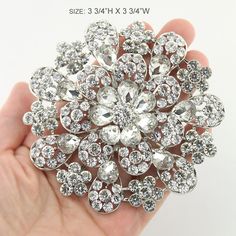 Stunning large crystal silver brooch rhinestone jewelry embellishment, which can be used for your DIY project - gold wedding, bridal dress sash, bridesmaid dress, wedding cake, ring pillow, event decor, crafts, scrap booking and much more. Size: 3 3/4 inch high 3 3/4 inches wide Stones color: Crystal clear Metal: Silver plated This gold crystal diamante brooch can be ordered with pin in the back to add to wedding gown or dress sash, to add to decorative pillow, or any number of other craft proje Large Wedding Cake, Large Wedding Cakes, Bridal Brooch, Wedding Bridal Dress, Silver Brooch Pin, Feminine Jewelry, Large Wedding, Dress Sash, Wedding Brooch