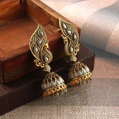 Overview These stylish Jhumki Earrings set from JewelryTrack will certainly leave you spellbound. These Jhumki Earrings set have an excellent finish and gives out an exquisite sense of style. If you are looking for an amazing Fashion Jewelry set for special occasions such as Anniversary, Engagement, Party, Wedding or for gifting , then your search ends here. Item Description: The look is stunning and preciously suitable for all kinds of dressy occasions. Metal: Brass OCCASION: PARTY WEAR , WEDDI Navratri Peacock Design Jhumkas, Festival Peacock Design Jhumkas For Parties, Peacock Design Jhumkas For Party And Festivals, Bollywood Style Peacock Design Jhumkas For Festive Season, Bollywood Peacock Danglers For Navratri, Party Peacock Design Jhumkas For Festivals, Bollywood Style Danglers With Peacock Design For Diwali, Bollywood Style Peacock Design Jhumkas For Festivals, Bollywood Peacock Danglers For Diwali