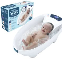 a baby laying in a bathtub with an electronic thermometer on it's side