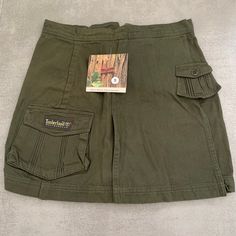 Embark on your next adventure in style with our Vintage Timberland Weathergea Cotton Cargo Skirt Shorts. Crafted for the intrepid traveler, these green cargo Skirt Shorts blend rugged utility with timeless safari-inspired design. Made from durable cotton, they're perfect for exploring the great outdoors or simply navigating the urban jungle with ease. With ample pockets for storing essentials and a comfortable fit for all-day wear, these vintage Skirt Shorts are both practical. Timberland Weathe Green Cargo Skirt, Vintage Safari, Skirt Shorts, Green Cargo, Vintage Rock, Cargo Skirt, Urban Jungle, Cyprus, Vintage Skirt