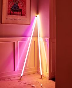 the light is shining brightly on the floor in the room with pink walls and white trim