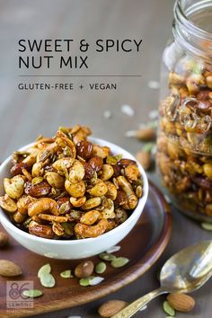 a bowl filled with nuts on top of a wooden plate