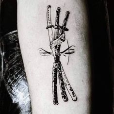 a black and white photo of a tattoo with scissors on it's forearms