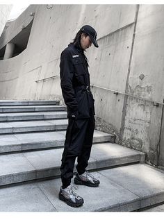 Vary your techwear styles at will with the last generation of workwear. Envision yourself navigating the pulse of the bustling city, a master of the urban jungle. Amidst the sea of monotony, you stand as a beacon of unique fashion. Your every step exudes confidence and style. You're not just fitting into the cityscape, but shaping it, reshaping it with your daring style and dynamic presence. And the key to this compelling persona? Our techwear working suits. These stylish techwear working clothes are not just attire—they embody innovative urban sophistication. An exquisite blend of Japanese workwear, the raw energy of cyberpunk culture, and the practicality of tactical gear, this sleek, robust working suit is a testament to the future of fashion. Its bold presence, available in striking da Urban Cargo Style Outerwear For Workwear, Urban Cargo Outerwear For Work, Urban Cargo Style Outerwear For Streetwear, Hip Hop Cargo Pants, Japanese Workwear, Mens Vest Casual, Working Clothes, Apocalyptic Clothing, Stringer Tank Top