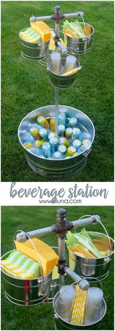 an outdoor beverage station made out of metal buckets