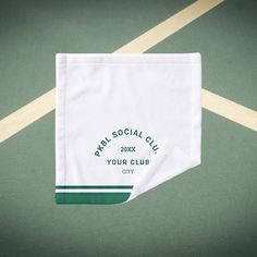 two napkins sitting on top of a tennis court with the words rapid social club printed on them