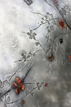 an abstract painting with red flowers and leaves on it's silver metal textured surface