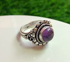 "Natural amethyst Vintage design ring, Amethyst ring, Sterling Silver Amethyst ring, Boho Silver Ring, Gift Item, Valentine Day Gift  Material : Brass Gemstones name : Amethyst  Color : As Pictured   Metal polish : Silver oxidized  \"If you have any queries about our item then Please contact Us \" HAVE A HAPPY SHOPPING WITH US ! THANK YOU" Purple Cabochon Amethyst Wedding Ring, Amethyst Cabochon Ring For Wedding, Cabochon Amethyst Ring For Wedding, Purple Cabochon Amethyst Ring, Purple Crystal Ring With Stone Setting, Handmade Purple Amethyst Ring For Anniversary, Purple Round Ring With Stone Setting, Round Purple Ring With Stone Setting, Handmade Purple Amethyst Wedding Ring