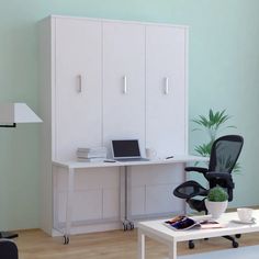 an office with a desk, chair and computer on the table in front of it