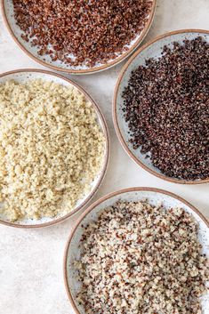 four bowls filled with different types of seeds