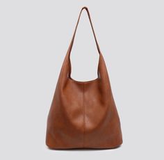 This beautifully well finished,very spacious ,strong and fashionably designed stylish brown hobo bag is made out of high quality PU vegan leather material. This can be given as a gift for her, gift for wife, gift for girl friend and etc This beautiful bag includes an extra inner purse. This top quality slouch bag is suitable to carry your day today essentials such as iPad, A4 Magazine, Book, Umbrella, Wallet, Water bottle, phone, Cosmetics.,etc. This stylish and pretty women's hand bag can be used as a handbag, shoulder bag, messenger bag, Tote, Hobo bag as you like. Perfect for dating, shopping, working, traveling, vacation, and other occasions and keep your daily items well organized. & This is a new trendy hand bag with an uncommon look and it's a strong bag. This gives an elegant look Bohemian Leather Hobo Bag With Large Capacity, Bohemian Large Capacity Hobo Bag For Shopping, Bohemian Hobo Bag For Everyday, Bohemian Soft Leather Hobo Bag For Everyday, Everyday Bohemian Soft Leather Hobo Bag, Holiday Handbag, Slouchy Hobo Bag, Slouch Bag, Vegan Tote Bag