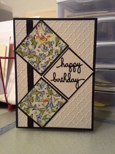 a happy birthday card on a table next to some crafting supplies and storage bins