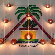 a decorative wall hanging with candles and lights in the shape of a potted plant