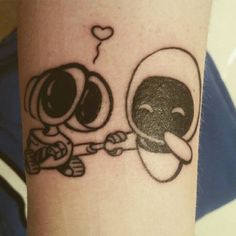 a couple of cartoon tattoos on the arm