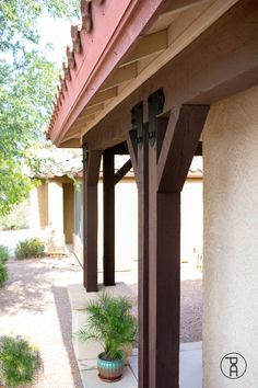 an outside view of a building with a potted plant