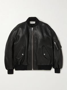 CELINE HOMME's bomber is one of many standout items from the SS22 collection. Riffing on classic flight jackets, it's cut from supple leather in a loose profile with a zipped pocket on the left sleeve. The back displays the house logo in white lettering with silver studs. Small to size. See Size & Fit notes. Vetements Jacket, Celine Clothes, Bridal Logo, Leather Jacket Men Style, House Logo, 2022 Ss, Trendy Jackets, Leather Jacket Style, Flight Jacket