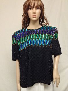 Stenay, Large Beaded Top, Black, Green ,PurpleTag reads LargeMeasurements:Bust 42"Length from top of collar to bottom 25"Excellent conditionJ 353Stenay, Large Beaded Top, Black, Green ,Purple Beaded Short Sleeve Top For Party, Purple Short Sleeve Blouse For Party, Beaded Short Sleeve Tops For Evening, Fitted Multicolor Beaded Tops, Velvet Fringe Kimono, Velvet Fringe, Muumuu Dress, Fringe Kimono, Womens Blouses