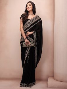 Black and gold-toned sareeEmbellished embroidered saree with embroidered border borderHas embroidered detailThe saree comes with an unstitched blouse pieceThe blouse worn by the model might be for modelling purpose only. Check the image of the blouse piece to understand how the actual blouse piece looks like.