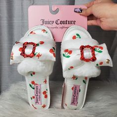 -Super Cute White Slippers With Red "Jc" Logo And Cherry Hearts All Over Them -Has Faux Fur Band With Silk Bow On The Top With Red Rhinstone Brooch In The Middle + Gold "Jc" Logo Charm On The Bow (Brooch Cannot Be Taken Off) -Has Rubber Sole -Cozy And Comfy -"Juicy Couture " Logo Tag Near The Heel Of The Slippers -White Jc-Gailee Slippers -New With Tags. No Damages Size : S (5/6) M (6.5/7.5) L (8/9) Xl (9.5/10.5) Juicy Couture Slippers, Heart Slippers, Fur Band, Fem Outfits, Cherry Hearts, Juicy Couture Logo, Slippers White, Fav Products, White Slippers