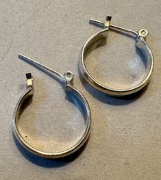 I don't know much about this besides it was my mother's. I am finally going thru her jewelry. The picture is all the info I have! Vintage Round Hoop Earrings With Ear Wire, Nickel Free Hoop Earrings For Anniversary, Vintage Nickel-free Hoop Earrings For Everyday, Nickel-free Small Hoop Earrings For Anniversary, Small Hoop Earrings For Anniversary, Nickel-free Small Hoop Clip-on Earrings, Jewelry Earrings Hoops, Silver Hoops, I Don't Know