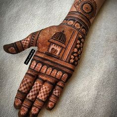 the hand is decorated with intricate designs