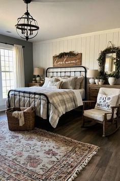 a bed room with a neatly made bed next to a chair and a rug on the floor