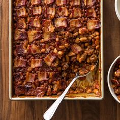 a casserole dish filled with baked beans and bacon