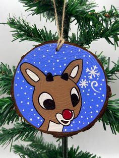 a wooden ornament hanging from a christmas tree