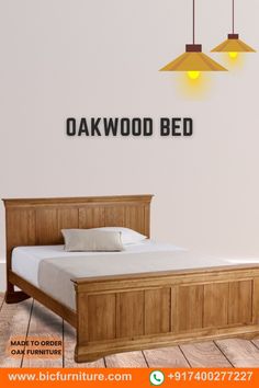 an oak wood bed with two lamps above it