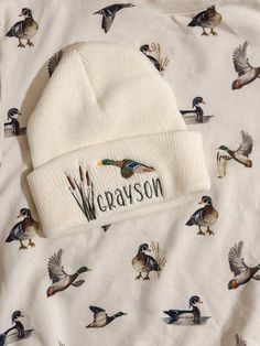 a white hat with ducks on it