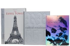 three books about the eiffel tower are shown in two different colors and sizes