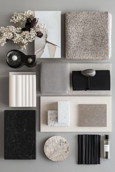 an assortment of different materials are arranged on the wall, including black and white decor