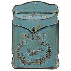 an old blue post box with a bird on it