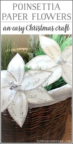 a basket filled with paper flowers on top of a table