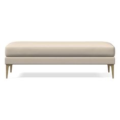 an upholstered bench with wooden legs and a beige fabric cover on the back