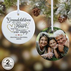 an ornament hanging from a christmas tree with two pictures of the same family