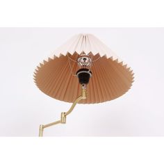 a lamp that is sitting on top of a table with a light bulb attached to it