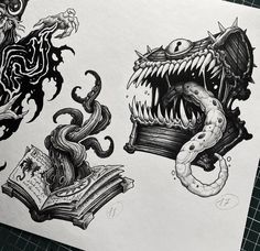 two drawings of monsters and books on paper