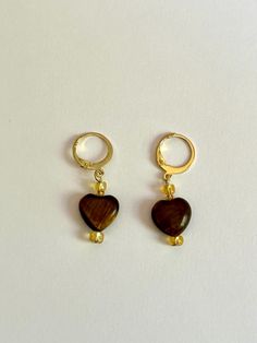 These handcrafted earrings are the perfect blend of style and sophistication, designed to elevate your look no matter the occasion. Each pair is carefully made by hand, featuring [describe key elements, such as gemstones, beads, metal accents, etc.] that bring a unique and artistic touch to every piece. Whether you're dressing up for a night out or adding a pop of personality to your everyday wear, these earrings are sure to make a statement. Crafted with high-quality materials like 14k gold plated hoops and tigers eye stone, these earrings are lightweight and comfortable for all-day wear. They make a thoughtful gift for birthdays, anniversaries, or just because. Key Features: Handmade, one-of-a-kind design Materials: 14k gold plated hoops, Tigers eye stone Lightweight and comfortable Perf Tigers Eye Stone, Metal Accents, Earrings Unique, Tiger Eye Stone, Eye Stone, Handcrafted Earrings, Tigers Eye, Metallic Accents, Jewelry Lover