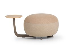 an ottoman with a table in the middle and a stool on one side that is shaped like a ball