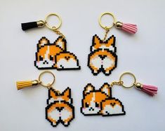 four key chains with different designs on them