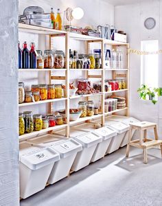 a room filled with lots of different types of jars and containers next to each other