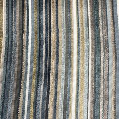 an area rug with multicolored stripes on it