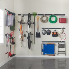 a garage with various tools hanging on the wall