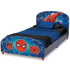 a child's bed with a spiderman headboard and blue bedspread