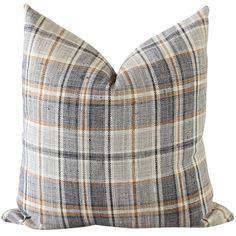 a plaid pillow on a white background