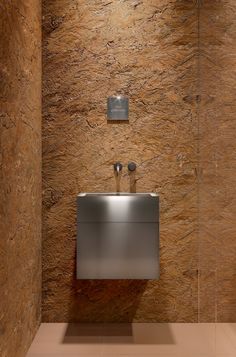 a bathroom with a sink, mirror and tiled walls in the shower area is shown