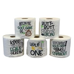 four rolls of toilet paper with slogans on them