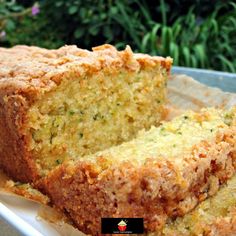 a loaf of zucchini bread sitting on top of a white plate